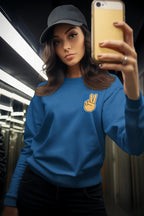 Royal blue crewneck sweatshirt with embroidered peace hand sign on chest.