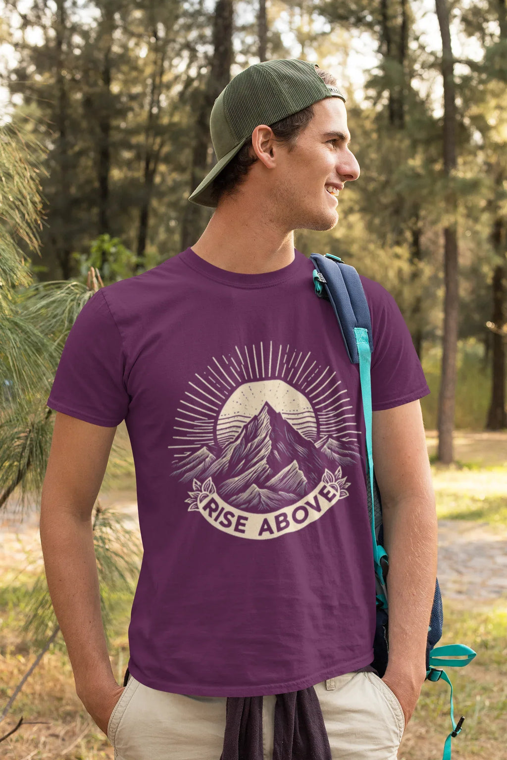 Purple short-sleeve T-shirt with mountain sunrise “RISE ABOVE” graphic on walker