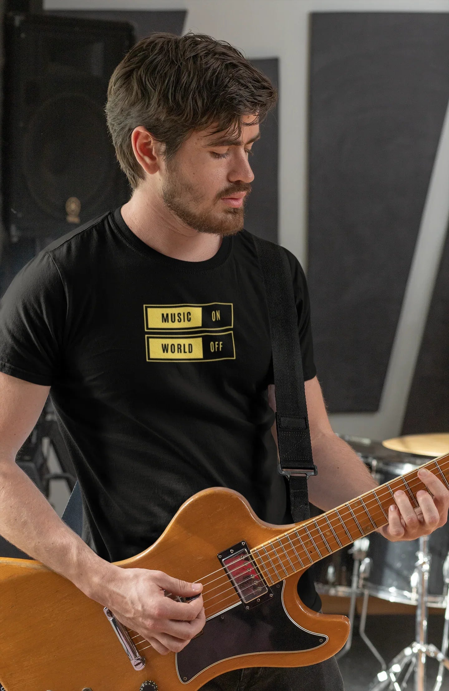 Black unisex T-shirt with “Music On / World Off” chest graphic