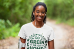 White unisex T-shirt with chest graphic print reading "GO GREEN OR GO HOME"