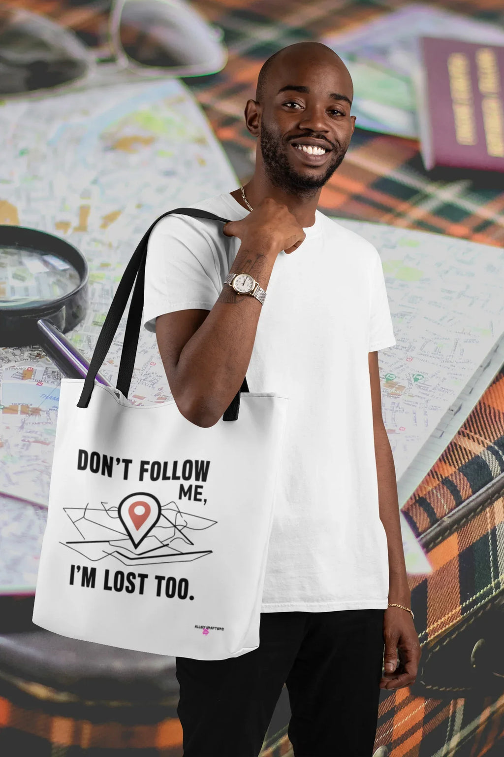 White canvas tote bag with black "DON'T FOLLOW ME" and "I'M LOST TOO" location-pin