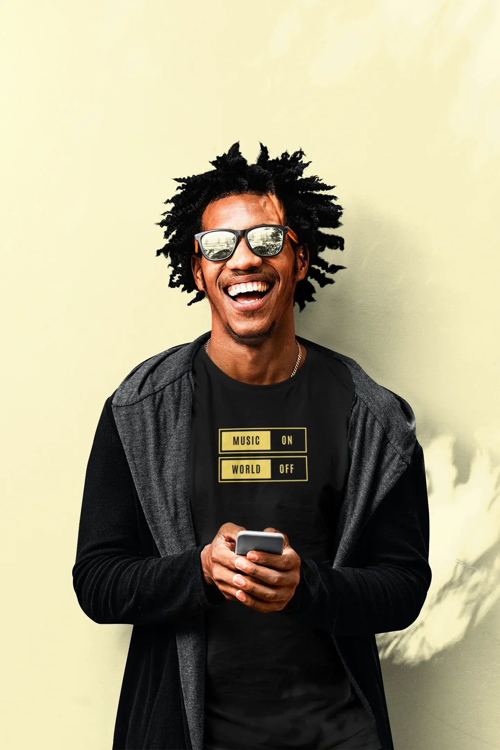 Black unisex T-shirt with “Music On / World Off” chest graphic