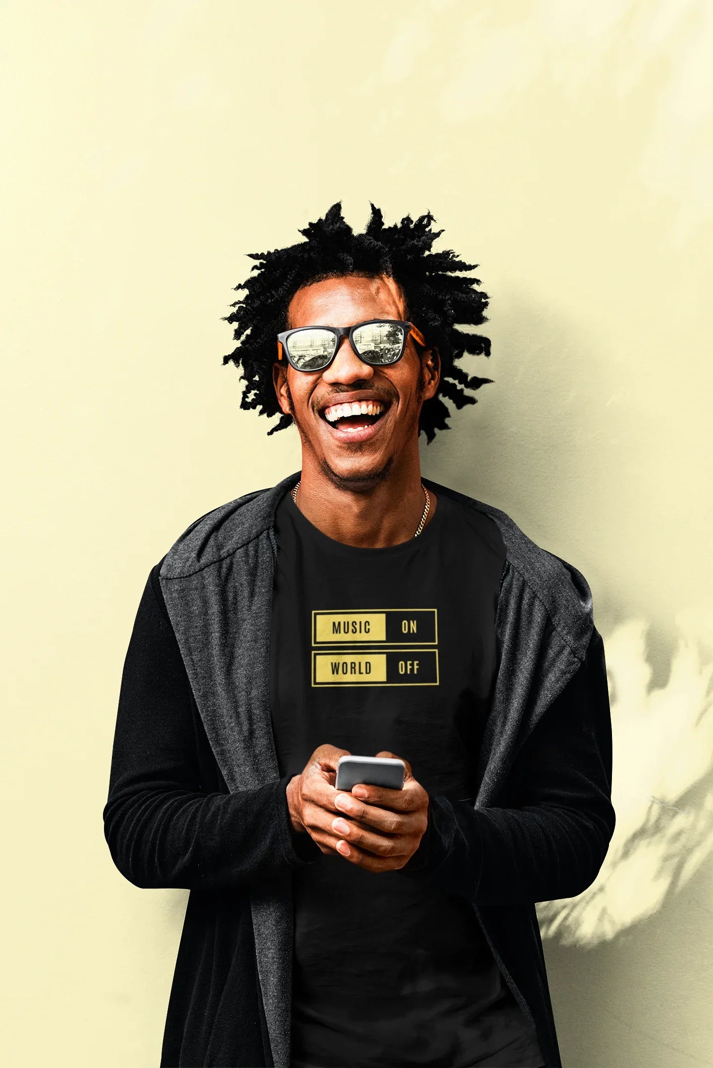 Black unisex T-shirt with “Music On / World Off” chest graphic