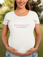 White heavy cotton maternity T-shirt with "Motherhood in Progress" print
