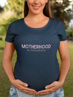 Maternity heavy cotton tee in navy with pink “Motherhood in Progress” logo print