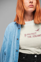 Light blue T-shirt with #PROTECT THE OCEANS graphic on the chest