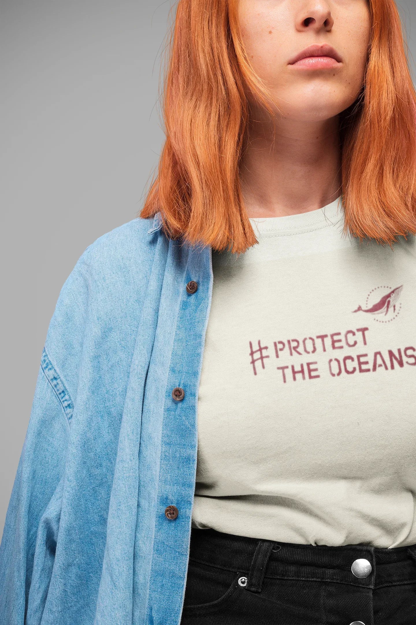 Light blue T-shirt with #PROTECT THE OCEANS graphic on the chest