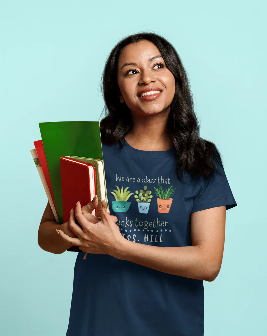 Navy teacher t-shirt with cartoon plants and “sticks together” front text