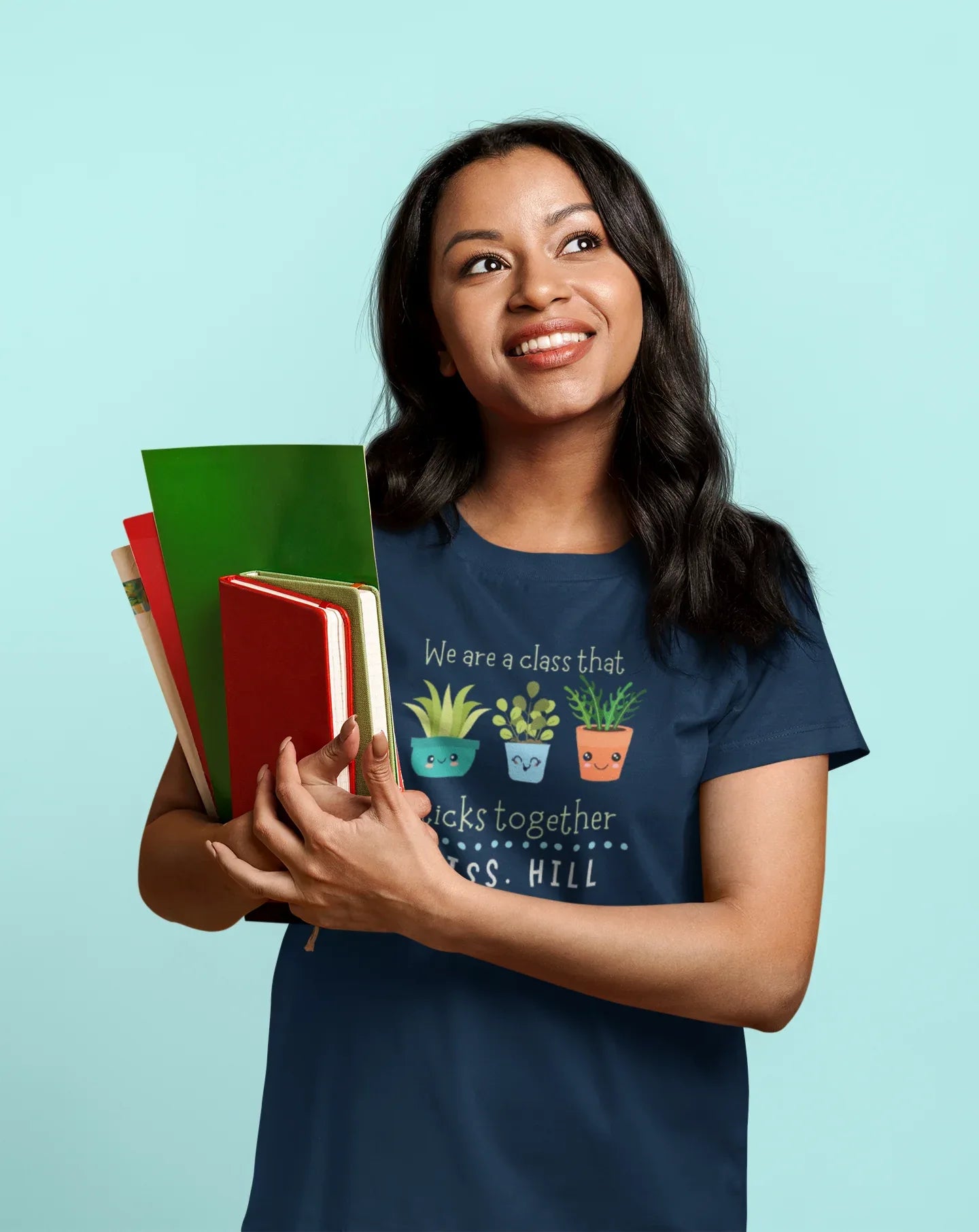 Navy teacher t-shirt with cartoon plants and “sticks together” front text