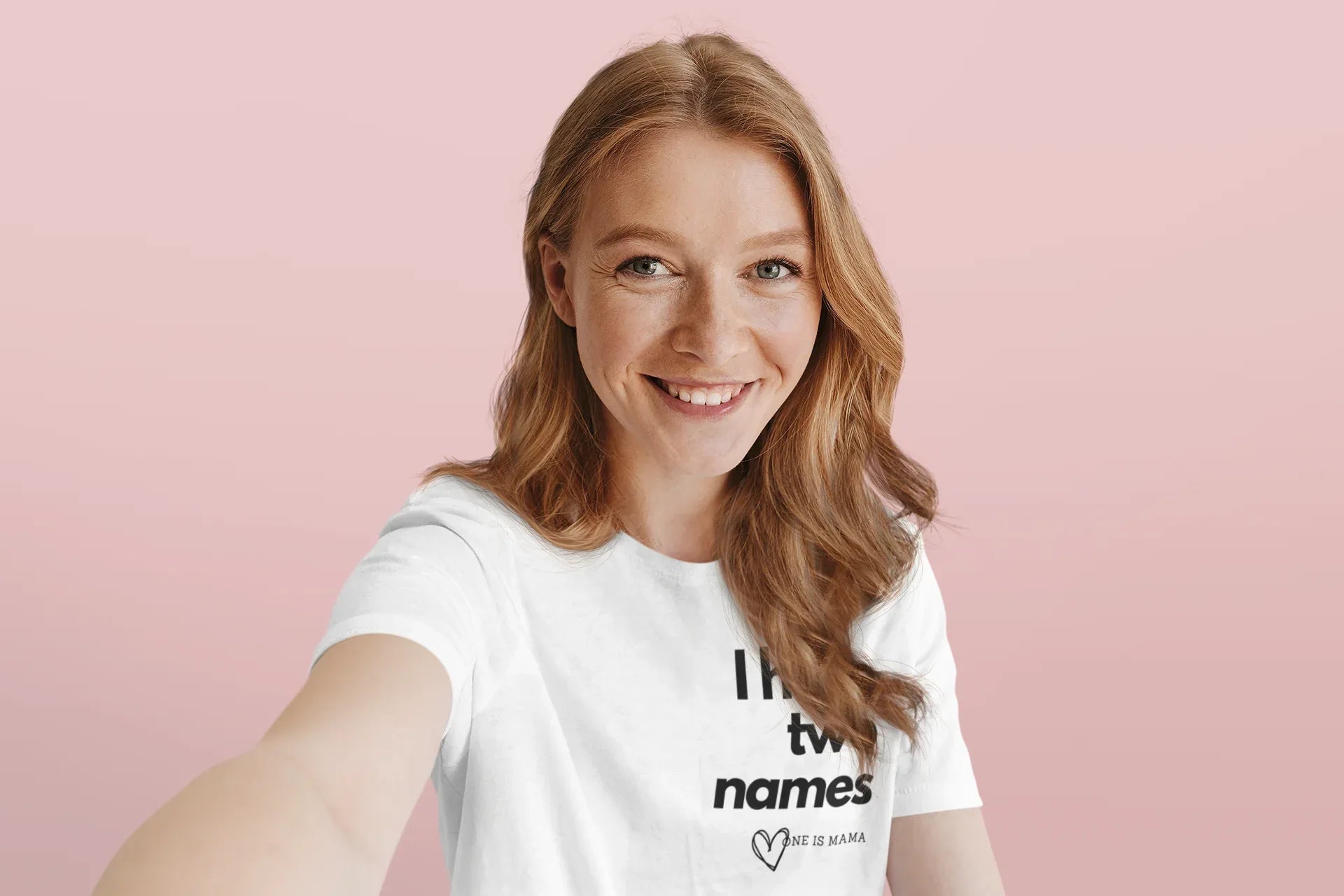 White crew-neck T-shirt worn by person, featuring 'I have two names' text print.