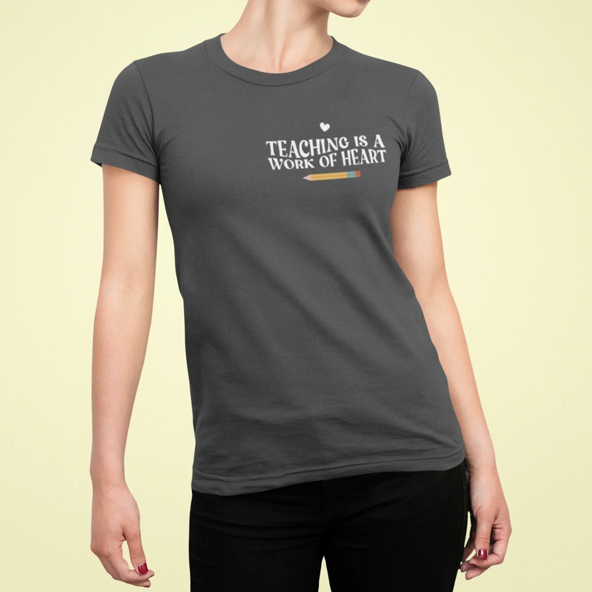 Charcoal unisex T-shirt with crew neck and “Teaching is a Work of Heart” chest print