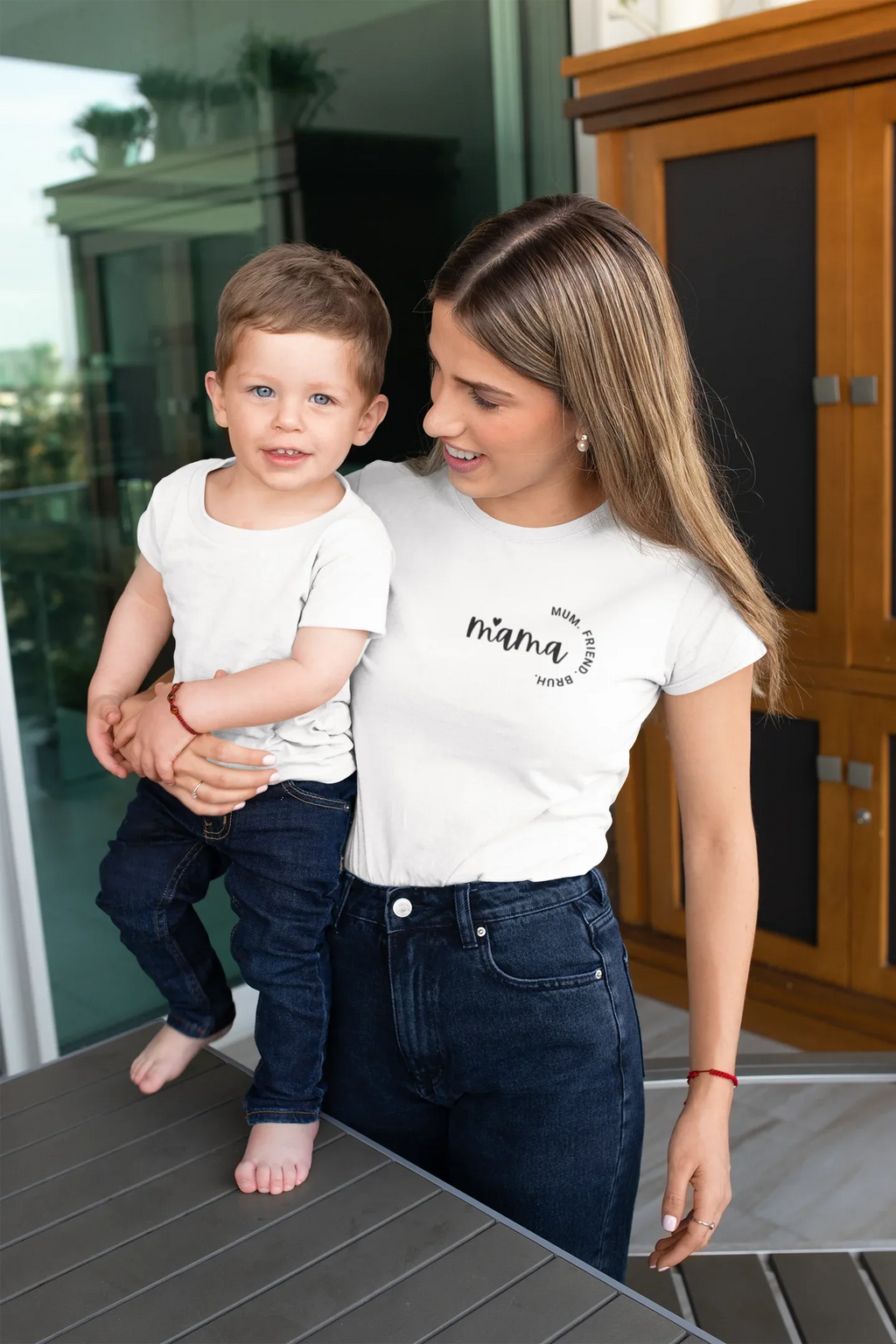 White mum T-shirt worn with jeans, short sleeves and chest logo