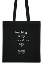 Black tote bag front, "teaching is my cardio" with "mrs ahmed" since 2024