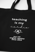 Black tote bag close-up, "teaching is my cardio" with "mrs hill" since 2014