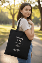 Black tote bag with handles, "teaching is my cardio" and personalized teacher text