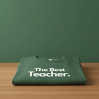 Green T-shirt with "The Best Teacher" text print