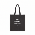 Black canvas tote bag with handles and “The Davies family” text and heart