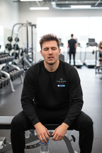 Black crewneck sweatshirt with printed chest logo, long sleeves