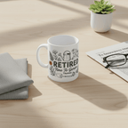White retired garden mug with 'RETIRED' and floral watering-can design, Thomas