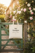 Natural canvas tote bag with handles and “The Thompson family” text design