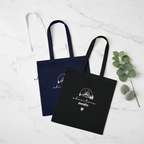 Cotton tote bags in white, navy blue, and black with mountain sketch and heart print