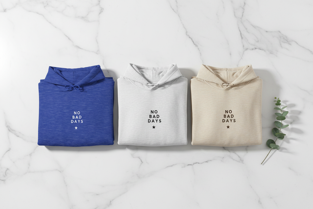 Set of three hooded sweatshirts in blue, ash gray, and cream with 'No Bad Days' logo