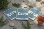 Three diaries on stone with lavender and river stones