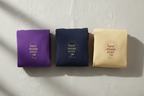 Set of 3 folded T-shirts: purple, navy, and cream, each with 'best mum ever' print