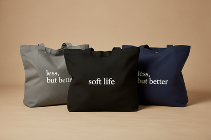 Three tote bags on neutral surface