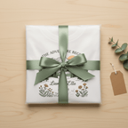 Wrapped white couples T-shirt with green bow, showing mountain landscape and floral print