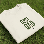 Light white T-shirt with green "Best Dad" typography graphic