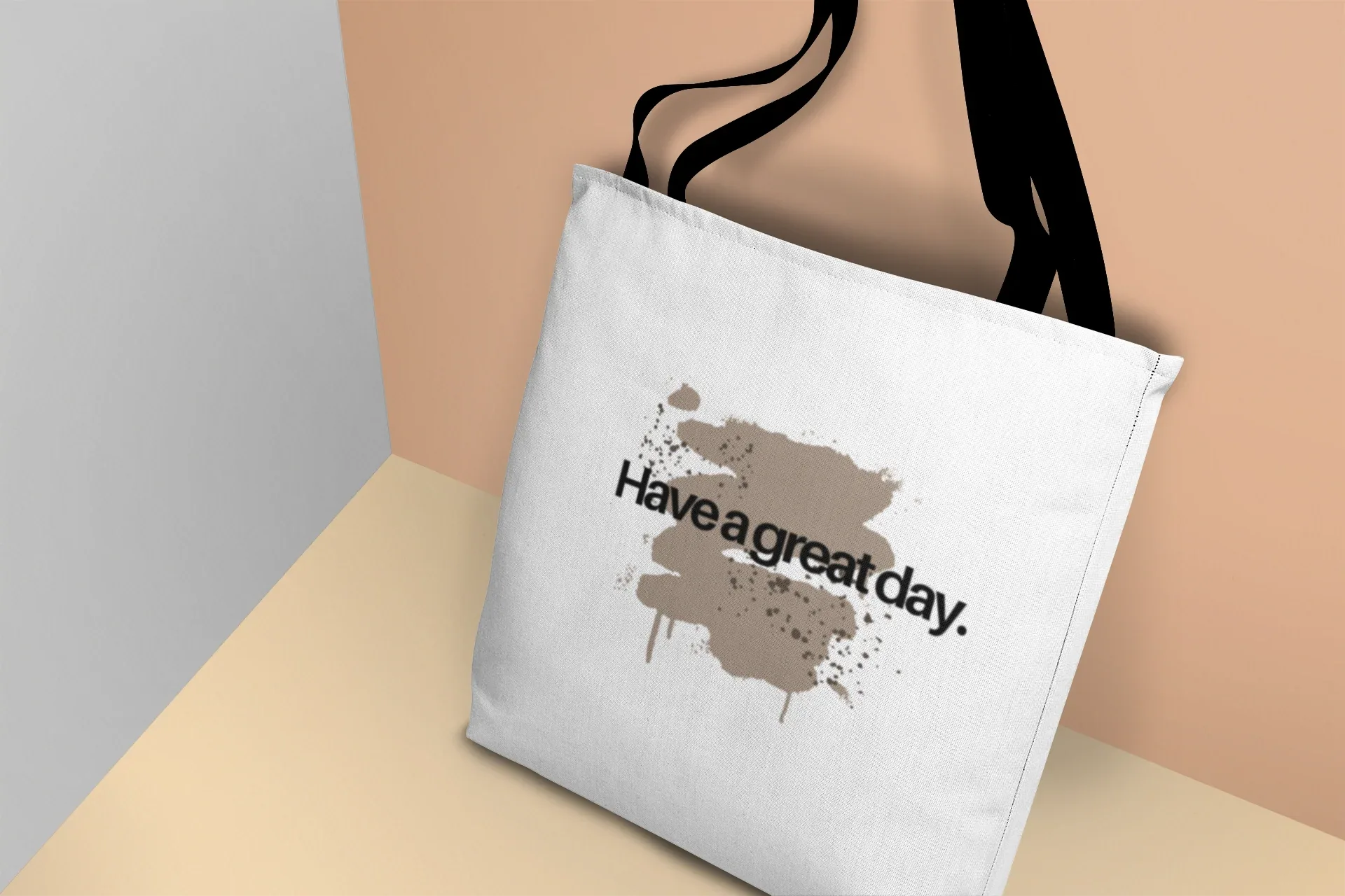 White canvas tote bag with black handles, side view of “Have a great day.” splash