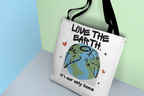 White tote bag with “Love the Earth” text and globe illustration on front