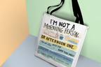 Beige tote bag with 'I'm not a morning person' and 'or afternoon one' text print