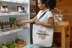 White canvas tote bag with “Have a great day.” text and brown splash design