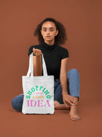 White tote bag with green "SHOPPING" and pink "IDEA" text