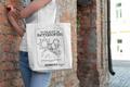White canvas tote bag with black front print and over-the-shoulder handles