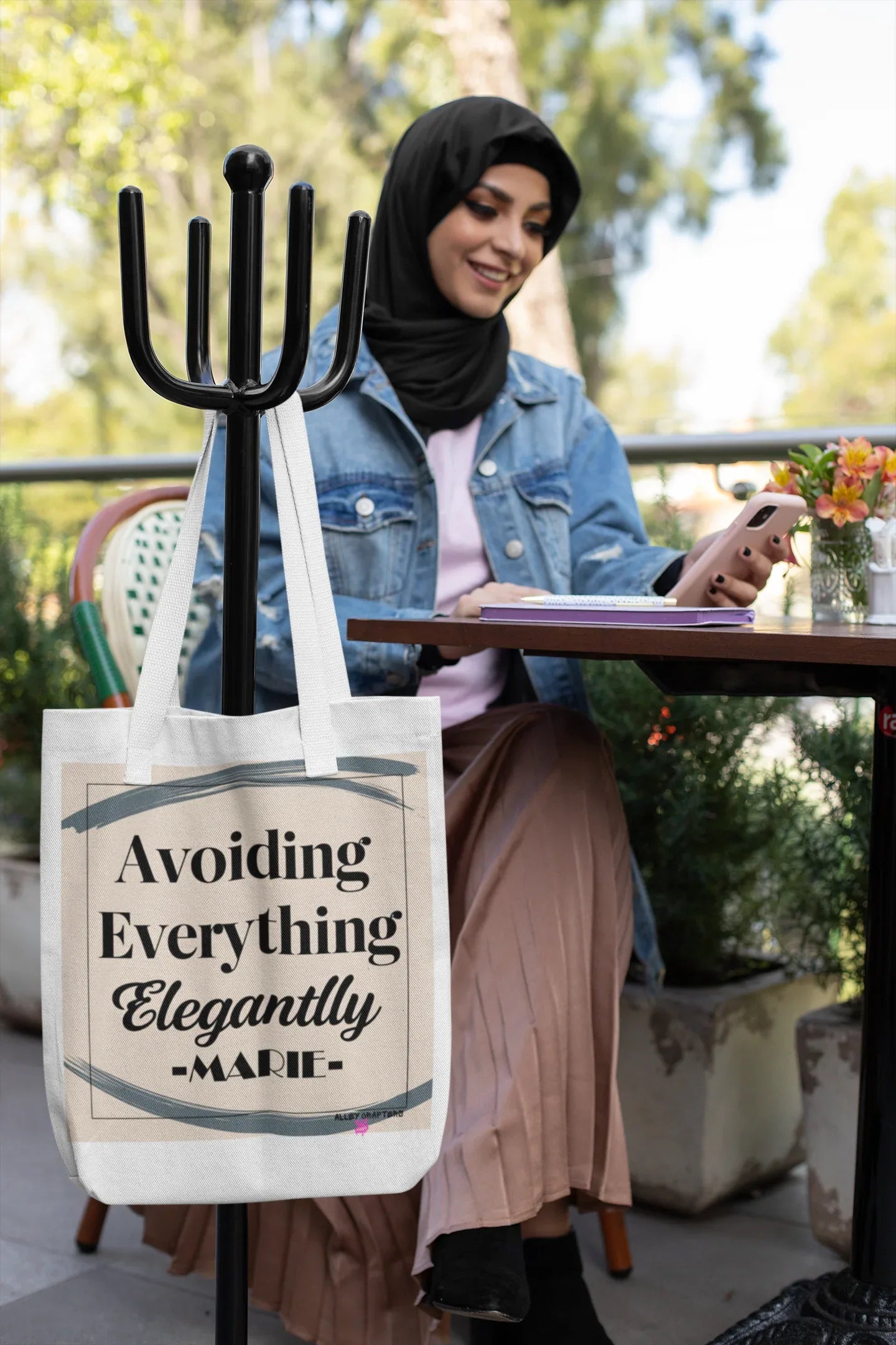 Canvas tote bag with “Avoiding Everything Elegantly” text and colorful graphic panel