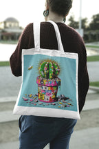 Tote bag with cactus artwork, white straps, light blue panel