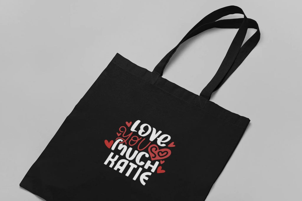 Black tote bag front panel with colorful heart 'Love you so much' text design