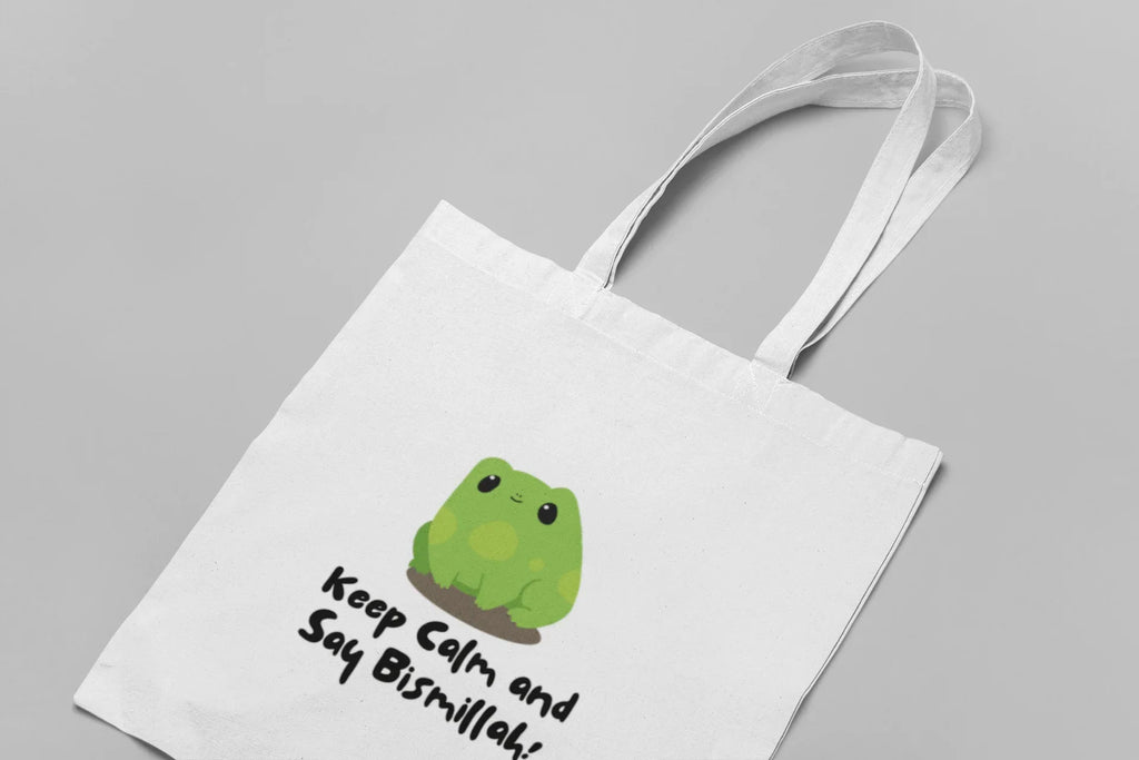 White cotton tote bag with frog graphic and slogan “Keep Calm and Say Bismillah!”