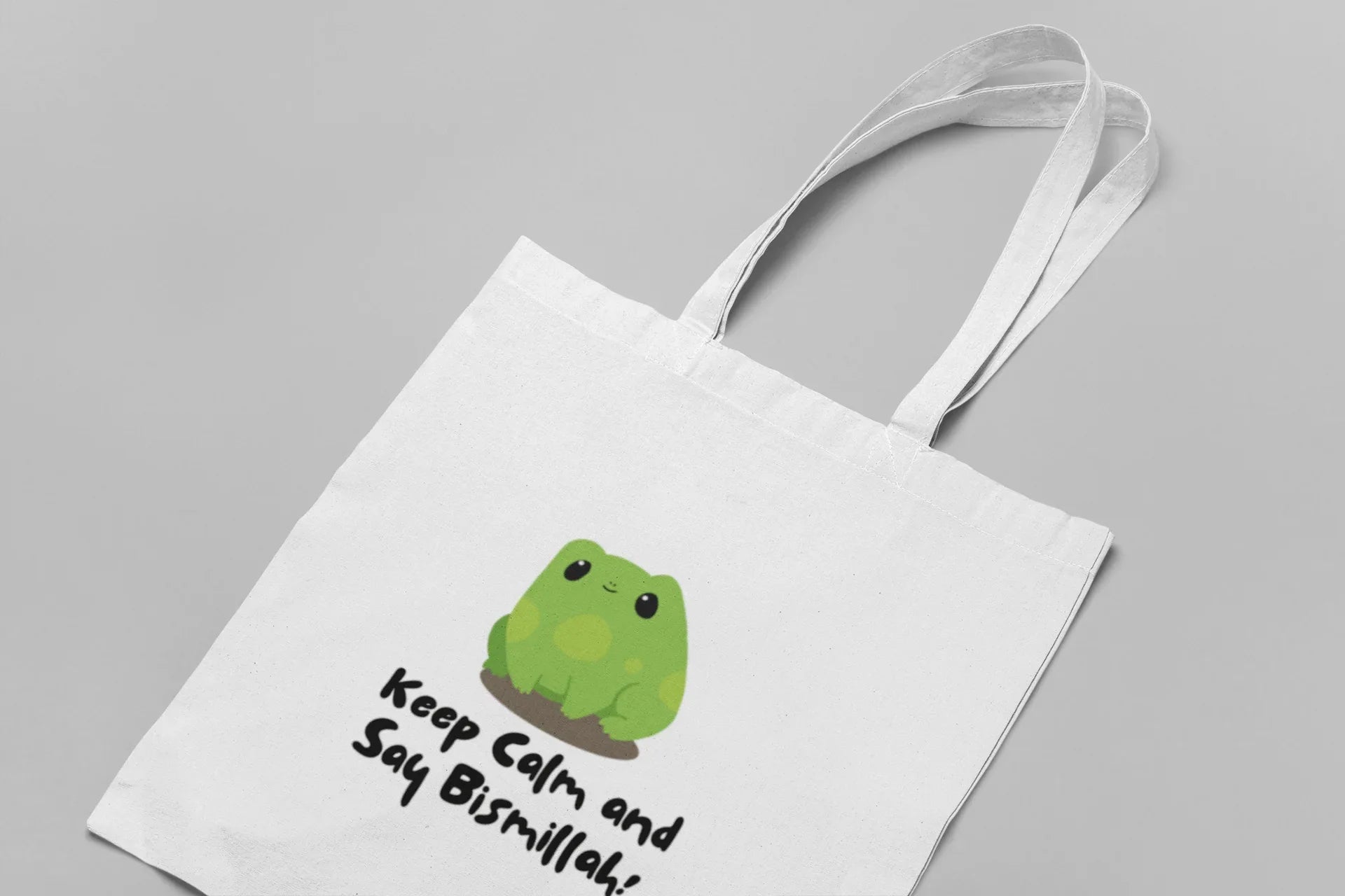 White cotton tote bag with frog graphic and slogan “Keep Calm and Say Bismillah!”