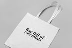White cotton tote bag with custom text reading “Bag full of essentials”.