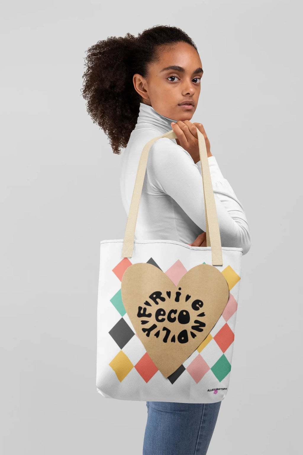 White canvas tote bag with heart logo, multicolor diamond design, cream handles
