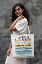 White canvas tote bag with “morning person” and colorful text graphic
