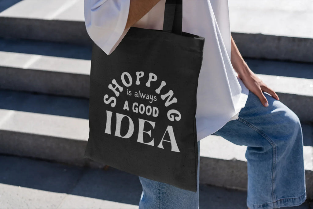 Black tote bag with white "SHOPPING is always a GOOD IDEA" lettering