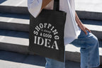 Black tote bag with white "SHOPPING is always a GOOD IDEA" lettering
