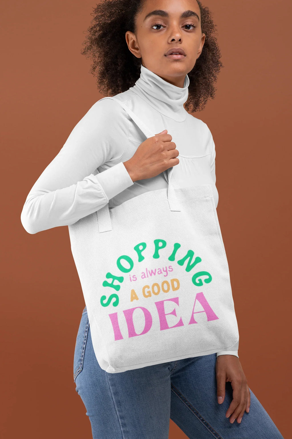 White tote bag with green and pink "SHOPPING is always a GOOD IDEA" text