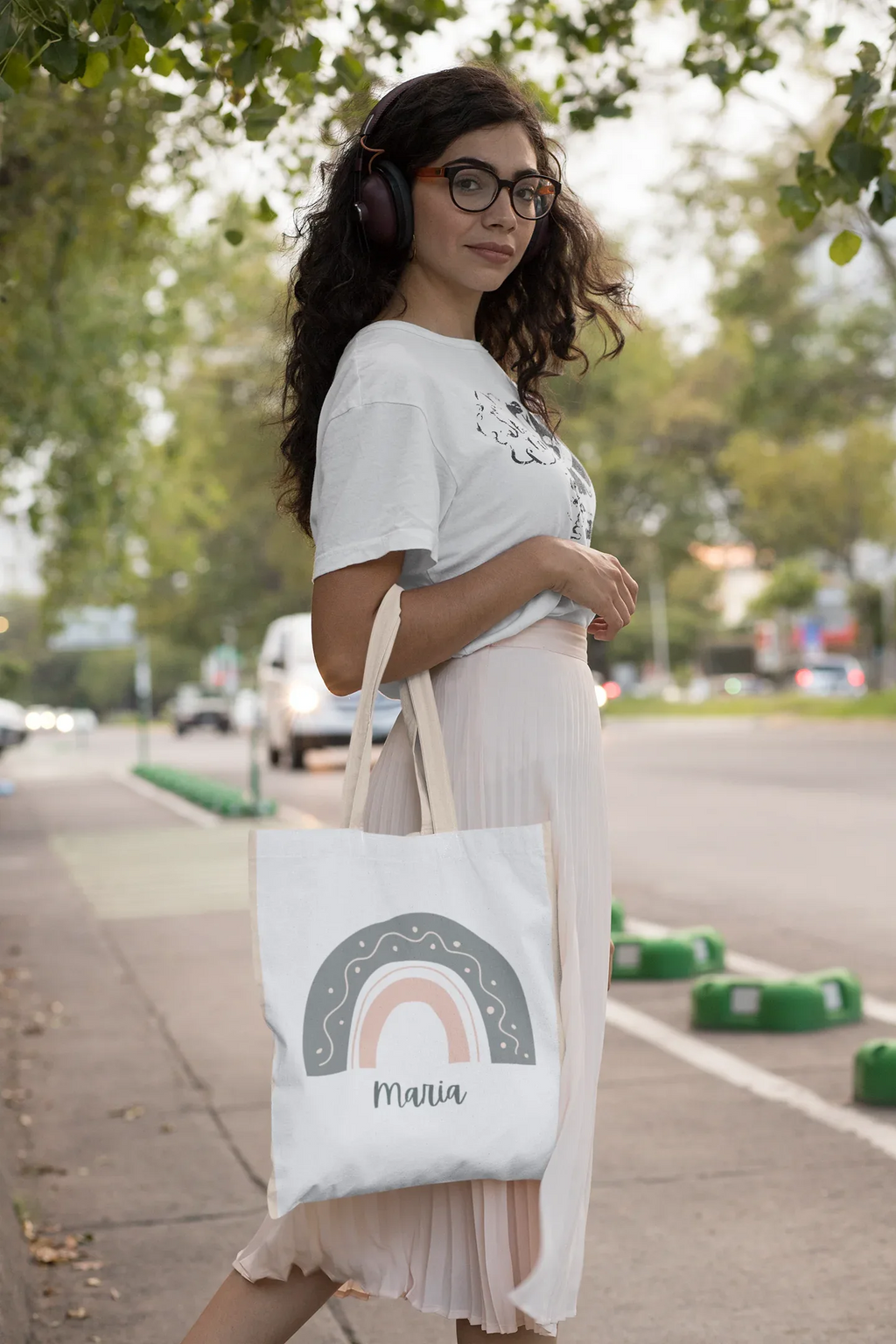 White tote bag with rainbow arch graphic and name Maria on front