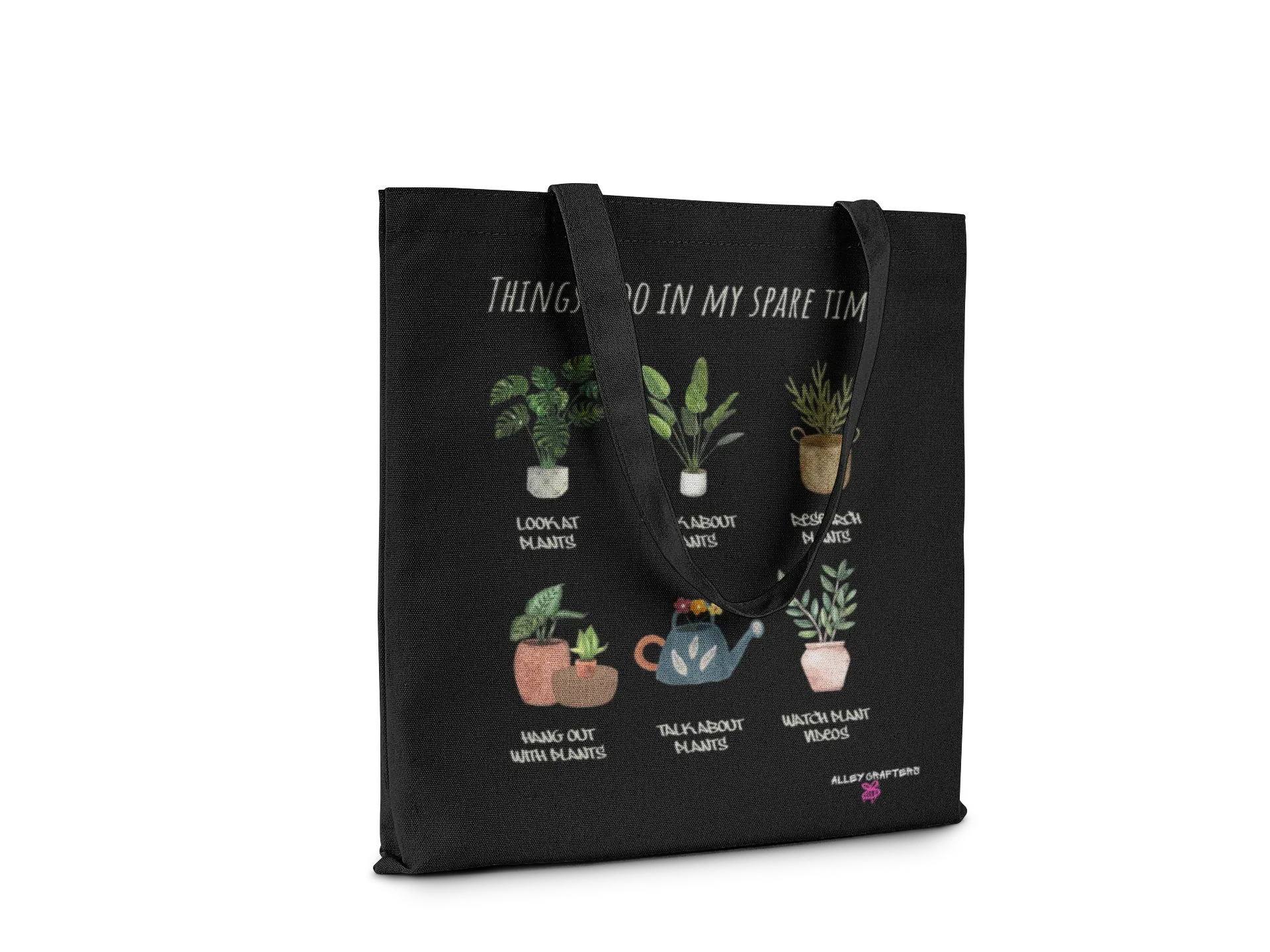 Black tote bag with plant-themed print and handles, text across top